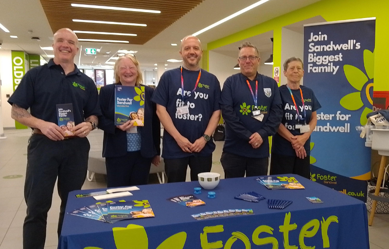 Pop up stand with members of the fostering team